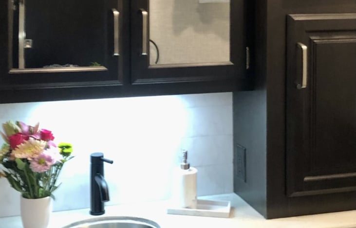 Main bathroom sink and cabinets.