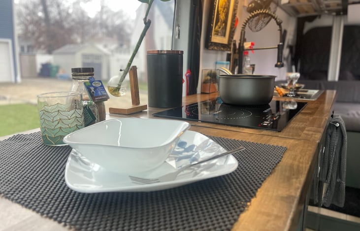 Immerse yourself in nature while indulging in an adventurous meal - open the van's large side door and let the great food and scenic beauty enhance your experience.  Place Setting for four!