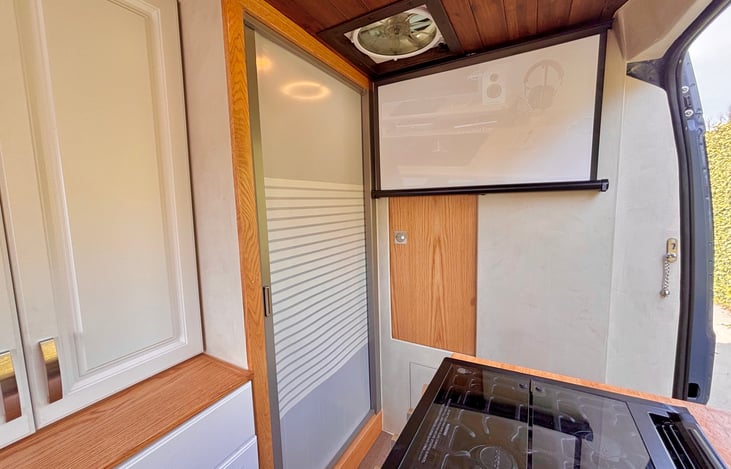 View from the kitchen to bathroom with the door closed