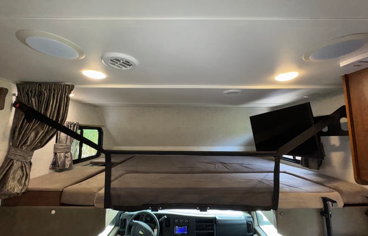 Overhead bunk with safety net is rated for 500 lbs and provides a queen size sleeping area approximately 80" long by 60" wide