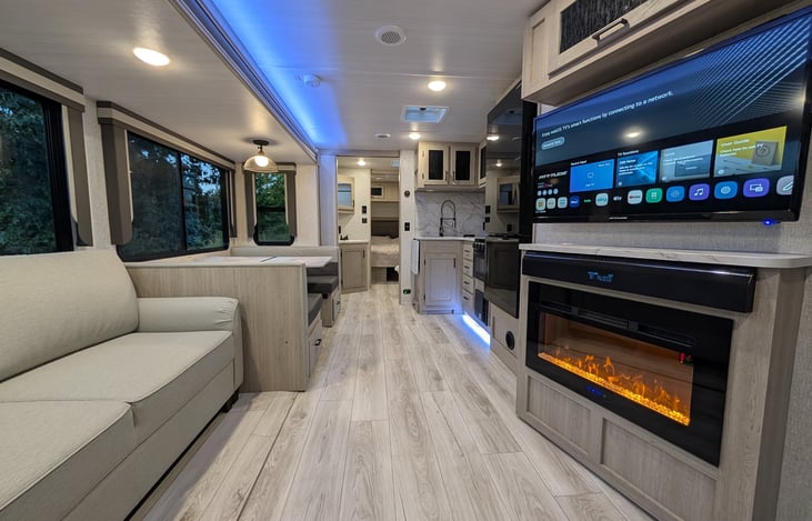 This open space from front to back gives your entire crew lots of indoor entertainment with central air or  fireplace that heats the whole living space.