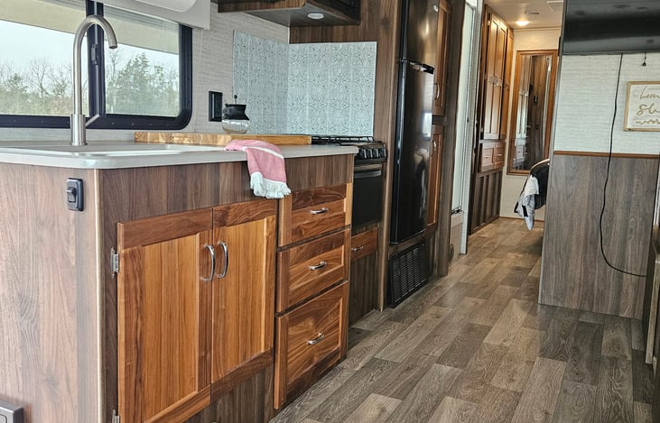 Kitchen has oven, stove top and microwave. The booth seating area seats 4.