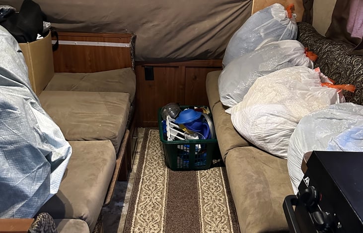 Table (folded down), sofa, front bed