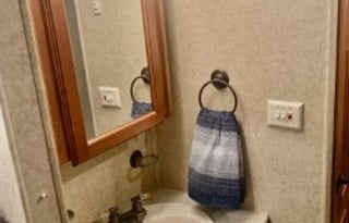 A 5th wheel travel trailer suited for 2 people