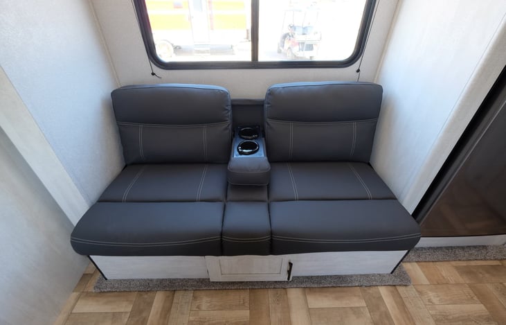 LOUNGE AREA THAT CAN BE CONVERTED TO BED, LED LIGHTS AND USB PORTS IN CUP HOLDERS