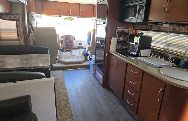 New Flooring, kitchen includes all utensils, plates,cups,glasses coffee maker,dish soap,dish towels,dry rack,spray nozzle attached to the sink, microwave, convection oven.