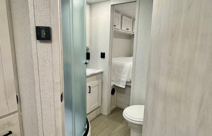 View from kitchen - looking into bathroom and the bedroom