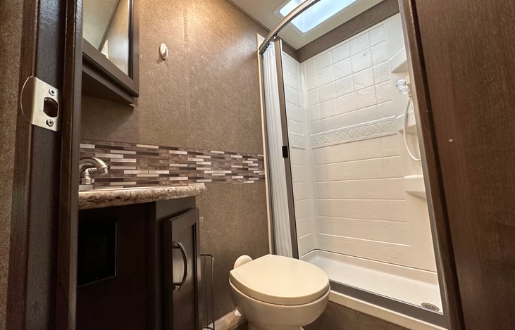 Bathroom with Vanity, Toilet, and Shower (with Headroom!)