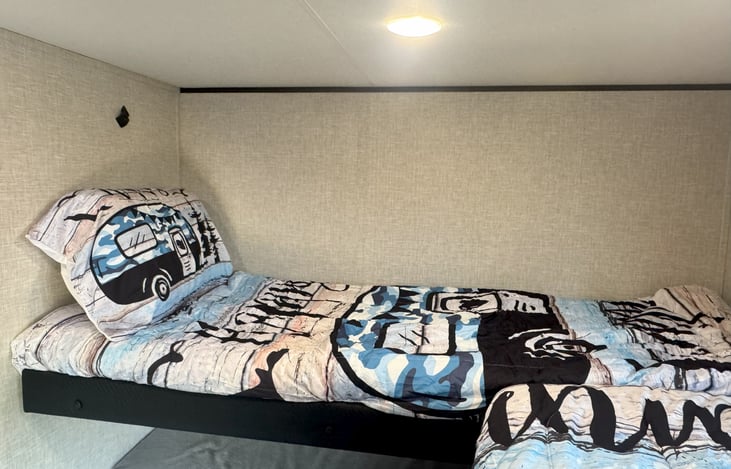 Twin bunk with bedding and pillow