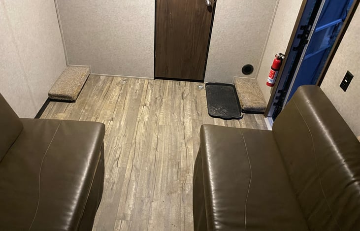 Garage/Rear Bedroom. Couches easily fold against wall to use as a garage.