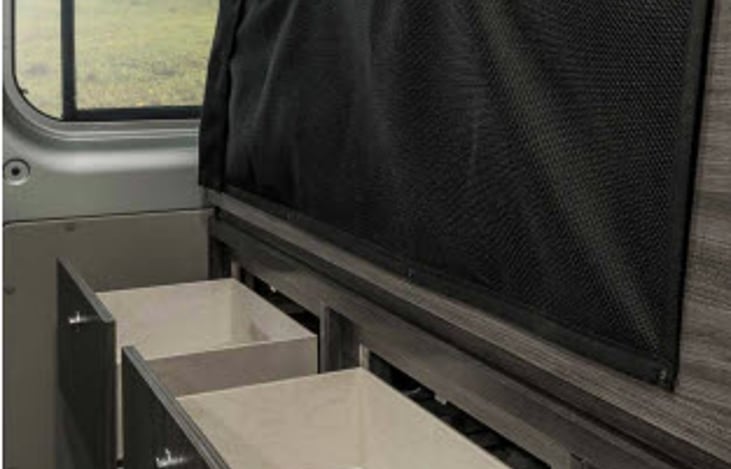 Below the bed there is plenty of drawers for storage space.