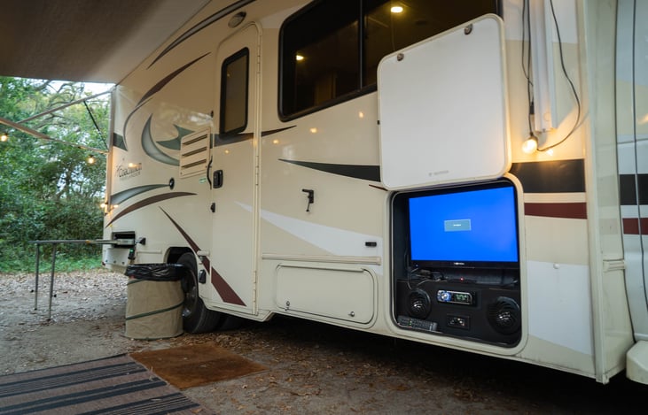 Pull out grilling table. Storage next to door.
Outdoor entertainment center. TV & Radio with speakers. HDMI & USB outlets on TV.