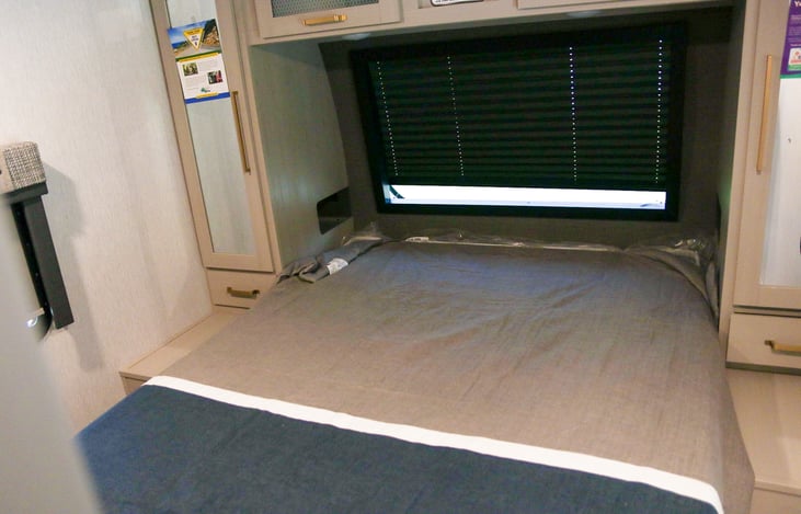 Master bedroom includes plenty of storage, electrical outlets and King size bed.