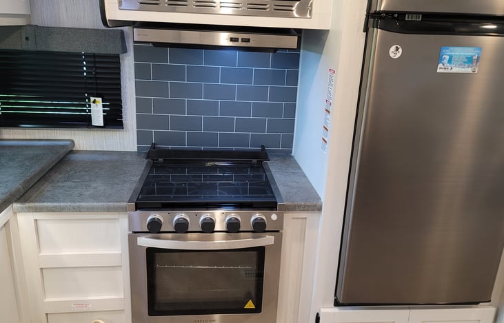 Prepare larger meals on the gas stovetop or in the oven.