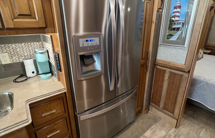 Full size refrigerator with ice and water dispenser