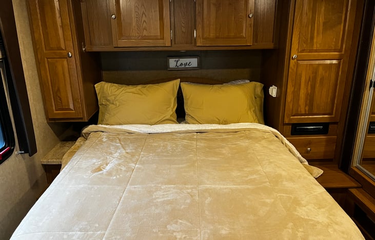 Queen size bed walk around with plenty 3 wardrobe closets and a night stand on each side.