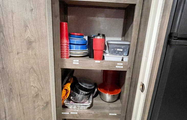Stocked Pantry with cooking utensils and small appliances