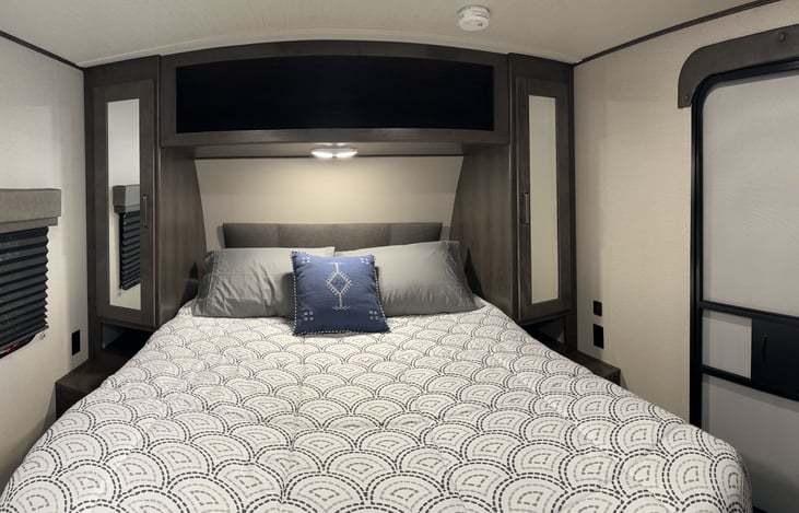 Queen bed master bedroom with storage on each side and underneath the bed also. Waterproof pillow and mattress protectors on all beds. 4 pillows on this bed. Also a foam mattress topper