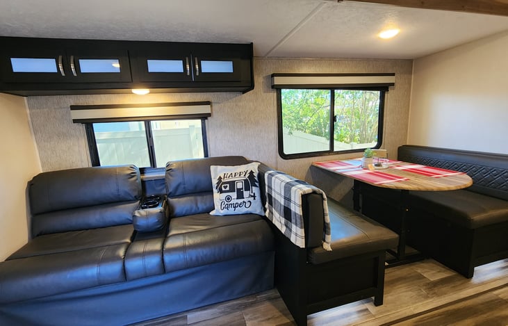 Sofa and dinning table turn into beds !! For extra a bed for extra visitors 😊 and a lot of windows to enjoy the view around campsite at all time