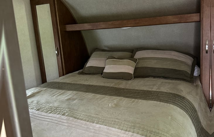 Master bedroom with upgraded queen mattress