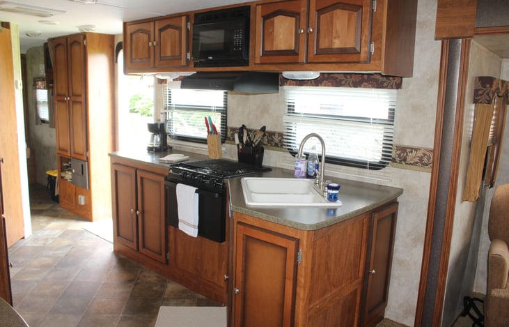 Kitchen is fully stocked! Dishes/flatware, paper plates/bowls, cooking utensils, pots/pans, coffee/hot water pots, toaster, spices/cooking spray, paper towels/napkins, baggies, foil, etc...