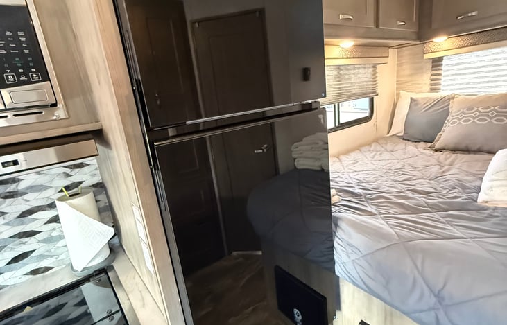 Fridge and queen bed