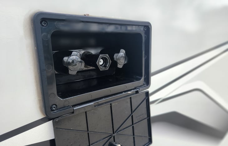 Outdoor Shower. The Shower Hose and Head are in the Travel Trailer Storage Compartment.