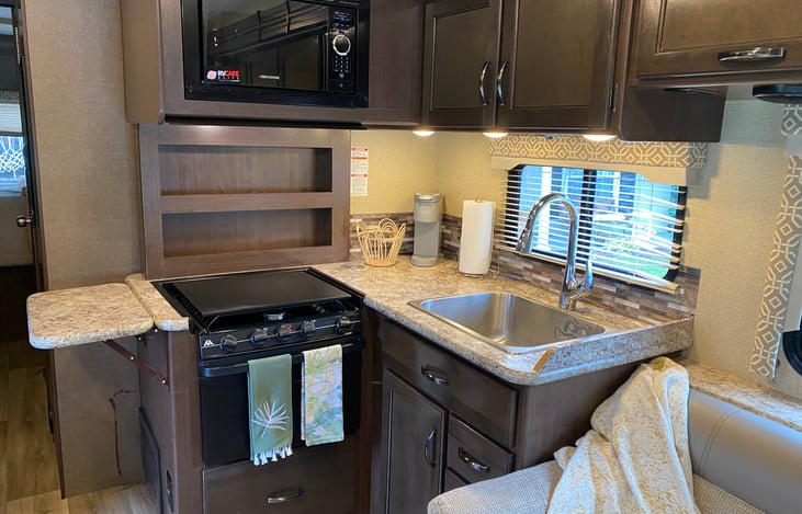 Kitchen: Fully stocked with dishes, flatware, cookware, and cutlery to meet all culinary needs. Also features a Keurig.