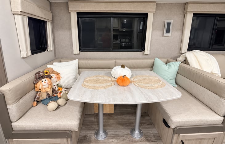 Spacious booth-style dinette — perfect for family meals, games, or relaxing together.