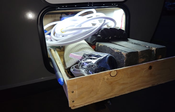 Outside access storage has pull out drawer. 
We added more lighting all over, including in this outside storage area.