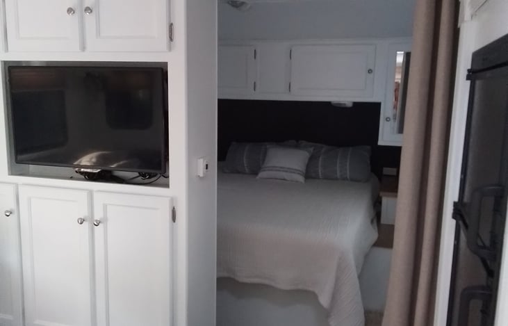 storage in cabintes seperating the bedroom from kitchen