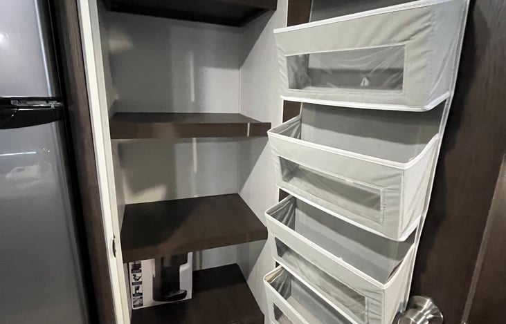 This is the spacious pantry next to the fridge!