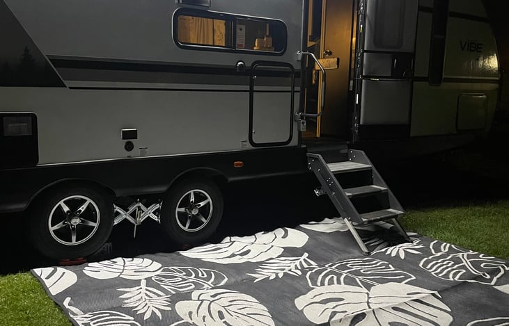 LED lighting outside with area rug.