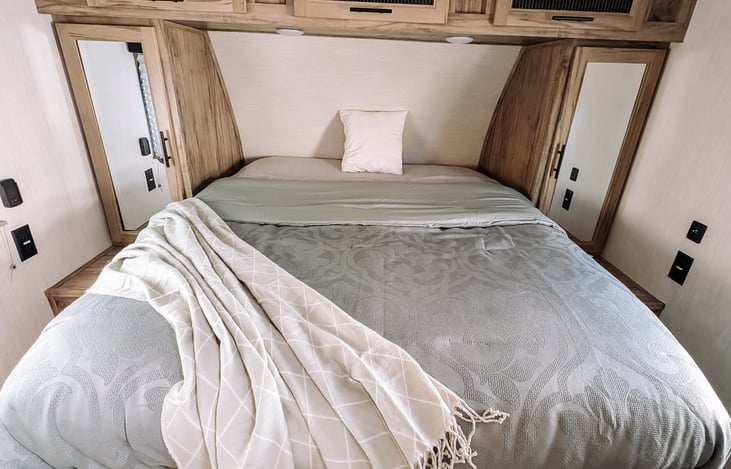 Master bedroom with a short queen bed, and comfortable foam pillowtop.