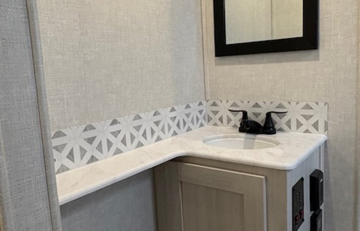 BATHROOM - sink area with lower storage