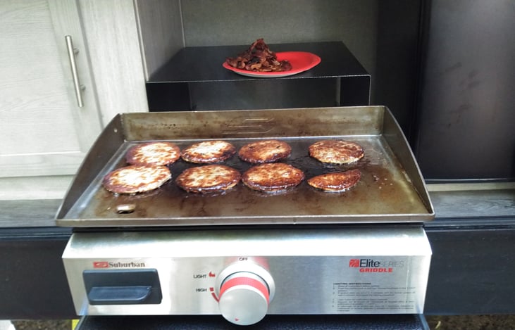 Outdoor Kitchen with fridge and grill.