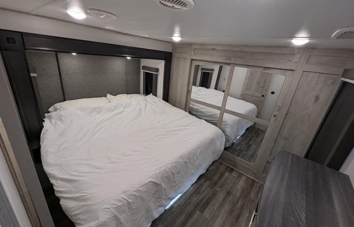 Rest easy in the King Suite. Features a massive wardrobe, stackable washer/dryer prep, and a dedicated master bath. Large windows and premium bedding make it a private, five-star sanctuary.