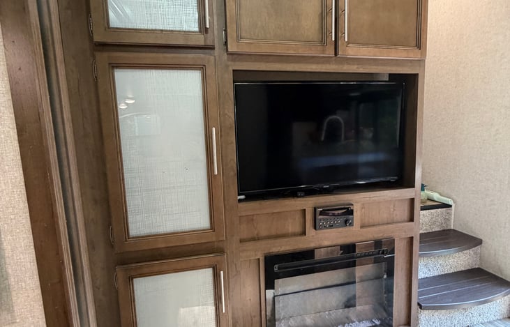 Fireplace for those cool fall nights and spring mornings. Large screen TV, CD player and plenty of storage