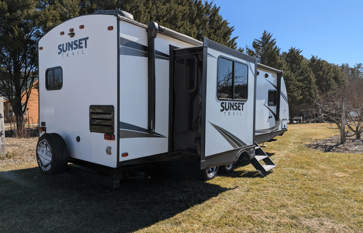 Luxury 30' triple-slide trailer with a gourmet rear kitchen & private master suite. Massive open-concept living and theater seating—the ultimate upscale home on wheels for your next getaway!
