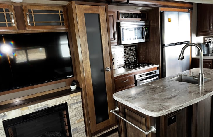 Nice pantry and full size fridge. 
Fireplace and tv.