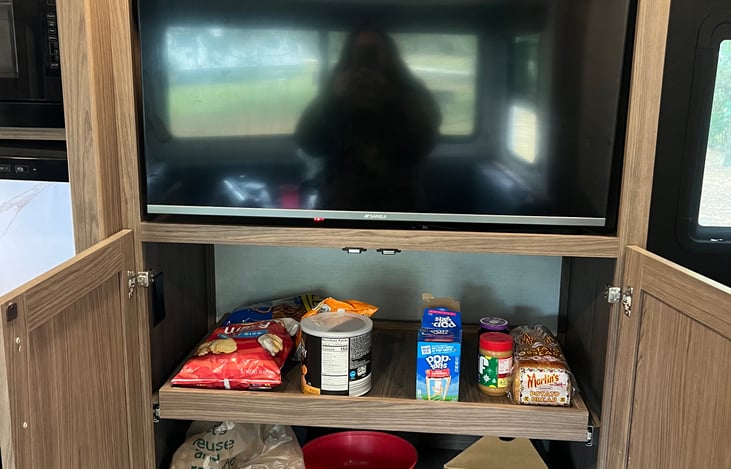 large sliding pantry under tv!