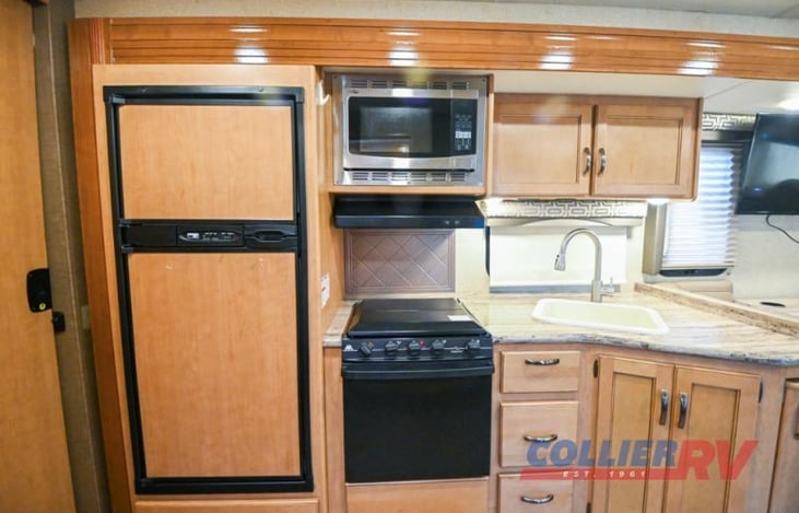 Microwave, stove, oven and refrigerator and freezer.