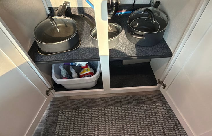 Supplied pots and pans, cleaning tubs and supplies.