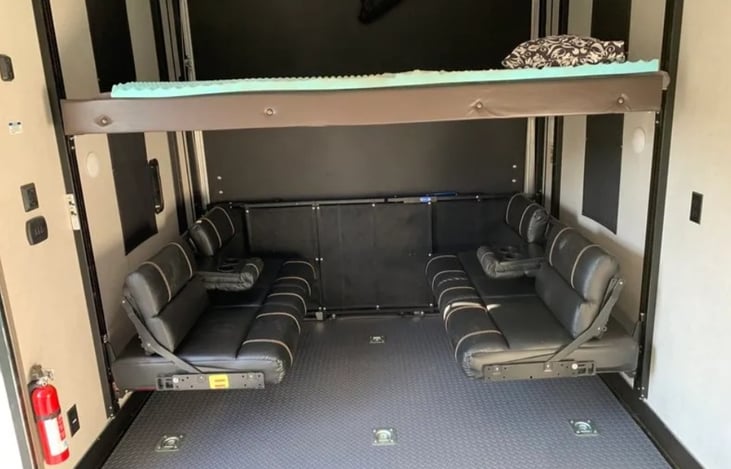 Bench seats can provide dining space. Collapsible table included with rental.