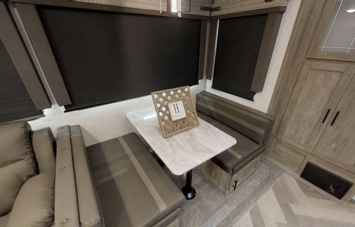 Table makes into a bed that sleeps 1 adult or 2 small children comfortably.