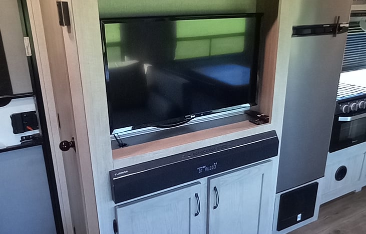 Entertainment unit with Smart TV and Bluetooth sound bar