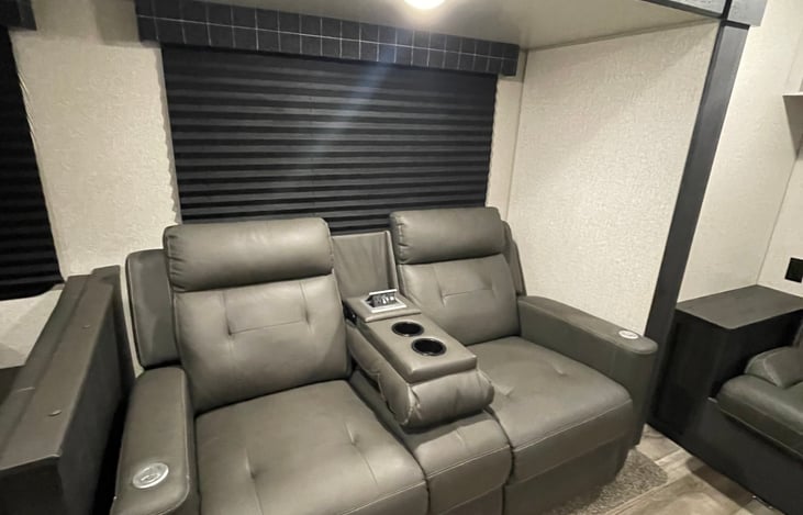 Two reclining chairs that are heated & massage.