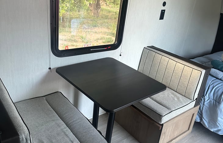 A table with storage under each bench. The table also folds down into a bed.