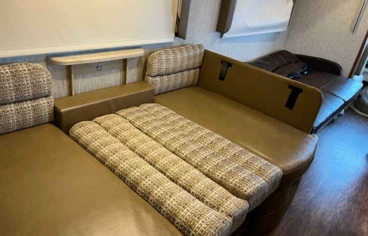 Dinette and sofa lowered into sleeping area