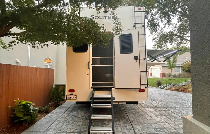 Secondary entrance at rear end of fifth wheel allows for easy private rear access to rear secondary bathroom and bedroom.